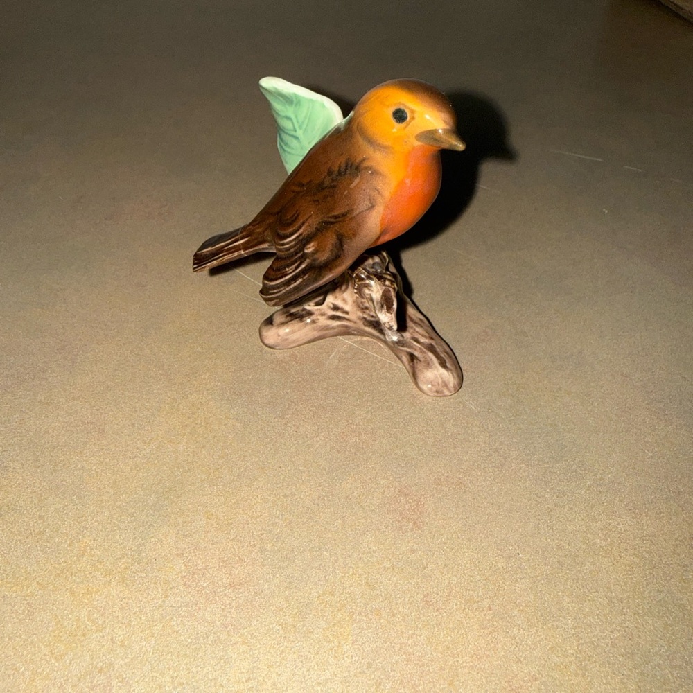 Vintage Goebel porcelain figurine of a robin perched on a branch